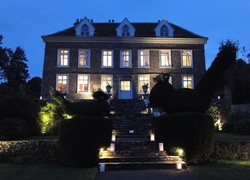 Photo of the front of the house at night